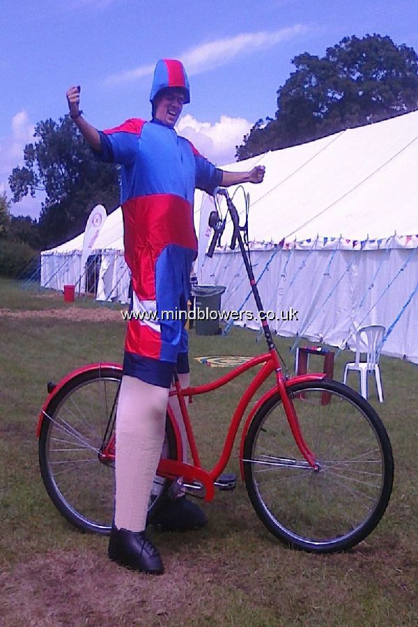 Racing Cyclist Stilt Walking on Stilt Bicycle